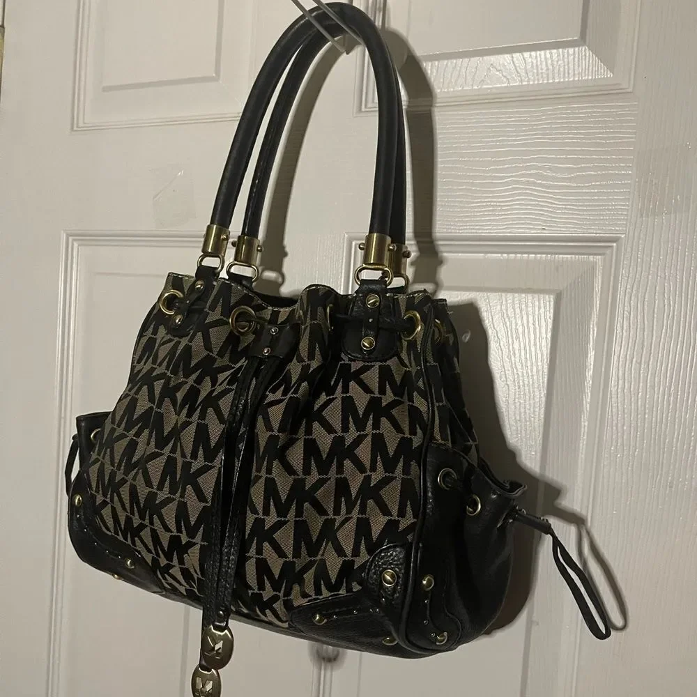 Michael Kors Black and Cream fabric logo Leather trims & strap shoulder Bag.